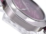 a close up of a wrist watch with a purple dial