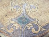 a wooden table with a decorative design on it
