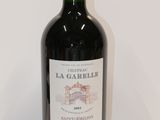 a bottle of wine that is sitting on a table