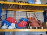 many different types of pipes and hoses on the shelves