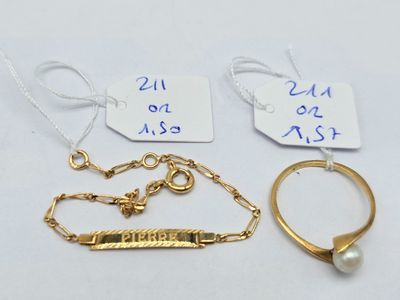 two gold rings, a bracelet, and a ring with a name tag