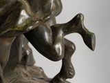 a statue of a man riding a horse on a rock