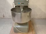 a mixer sitting on a pallet in a room