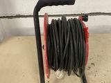 an image of a hose on a cart in a garage