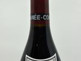 a bottle of wine that is sitting on a table