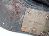 a close up of a leather purse with rivets and rivets on it