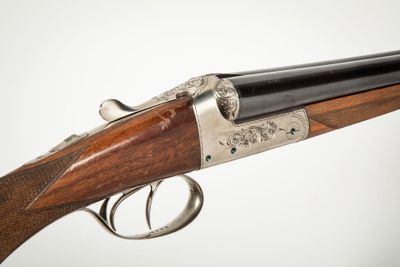 a close up of a rifle with a gun on it