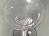 a wine glass sitting on top of a table