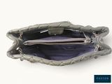 the inside of a gray purse with a zipper on the inside