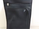 a black piece of luggage that is sitting on the floor