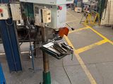 an image of a machine in a factory with a lot of tools