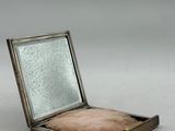 an old silver box with a mirror on top of it