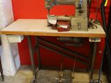 a sewing machine sitting on a table in a room