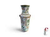 a vase that is sitting on a white surface