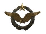 une image représentant un insigne surmonté d'une étoile