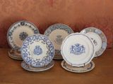 several blue and white plates are stacked on top of each other