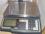 a scale that is sitting on top of a wooden table
