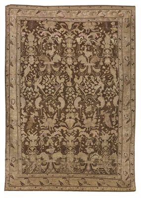 a brown and beige rug with a floral design on it