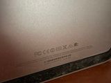 a close up of a laptop on a wooden table