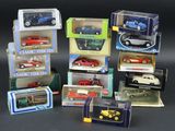 a lot of toy cars in boxes on a table