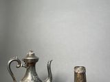 pair of silver plated teapots and a silver plated teapot