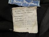 a label on a black jacket that says made in france