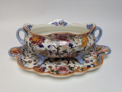 a bowl and saucer on a saucer on a plate