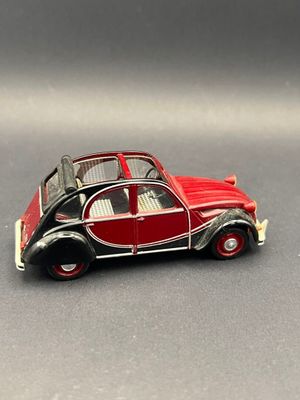a small toy car that is sitting on a table