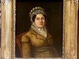 painting of a woman in a brown dress and bonnet in a gold frame