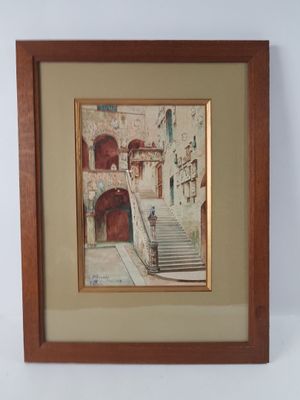 framed picture of a picture of a building with a staircase going up it