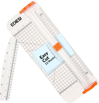 an image of a paper cutter next to a ruler on a white background