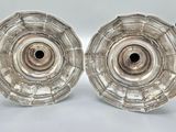pair of silver plated candlesticks on a white background