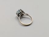a close up of a ring on a table with a white background