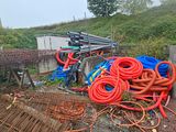 a pile of hoses sitting on top of a pile of dirt