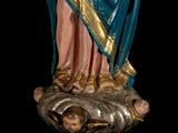 a statue of a woman holding a baby in her arms