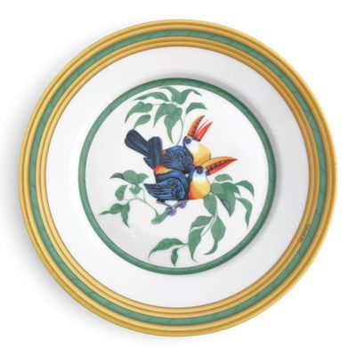 a plate with a bird painted on it on a white background