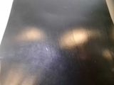 a close up view of a black table top