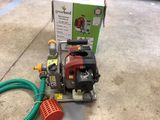 a box with a hose and a pump on the floor