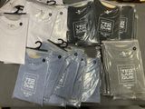 a lot of t - shirts that are on a table
