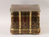 a small wooden box with a decorative design on it