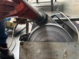 a man that is using a machine to make something