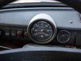 steering wheel of a car with a speedometer and gauges