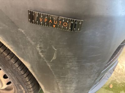 a close up of a sticker on a car ' s bumper
