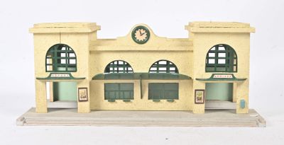 a small model of a building with a clock on the top