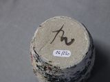 a close up of a piece of wood with a sticker on it