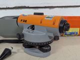 an orange and gray electric tool sitting on top of a table