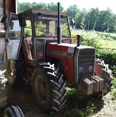 a tractor that is parked next to a building