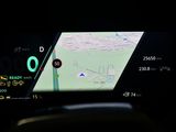 the dashboard of a car with a gps device on it ' s display