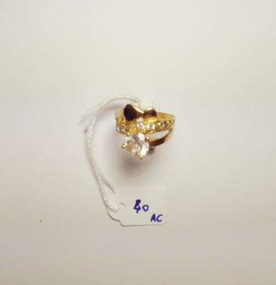 an image of a gold ring with a diamond on top of it