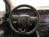 a picture of the interior of a car with a steering wheel